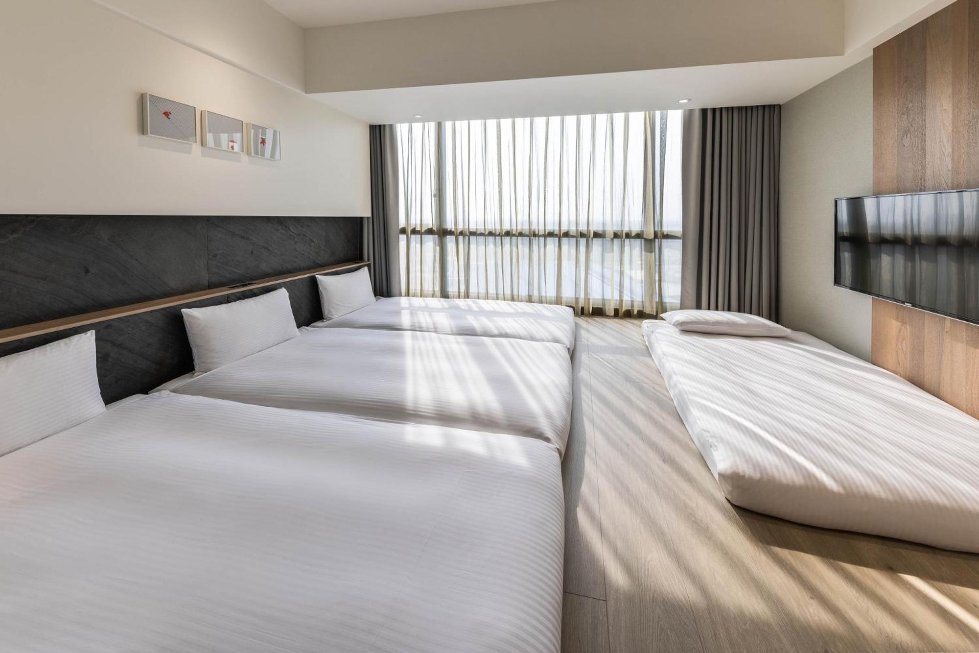 Hsin Hotel นครเจียอี้ ห้อง รูปภาพ A room at the hotel